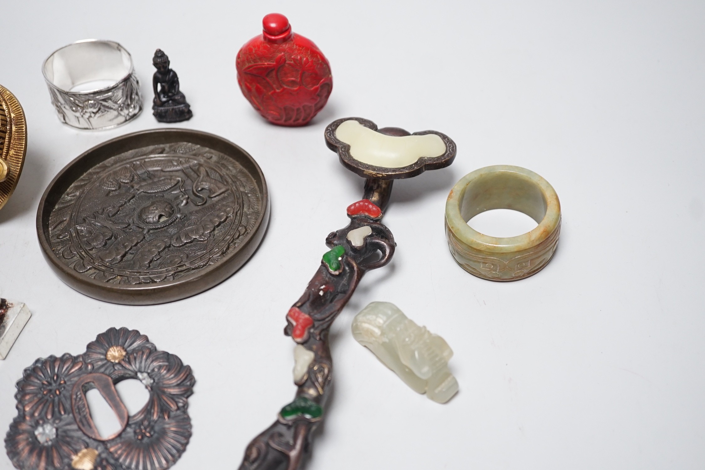 A selection of various Oriental items, including Chinese hardstone carvings, Japanese cast bronze mirror, snuff bottle, Japanese napkin ring etc.